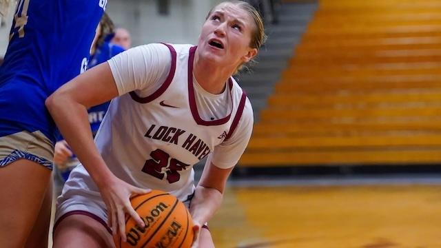 Madeline Evans sets to shoot in DII women's basketball.
